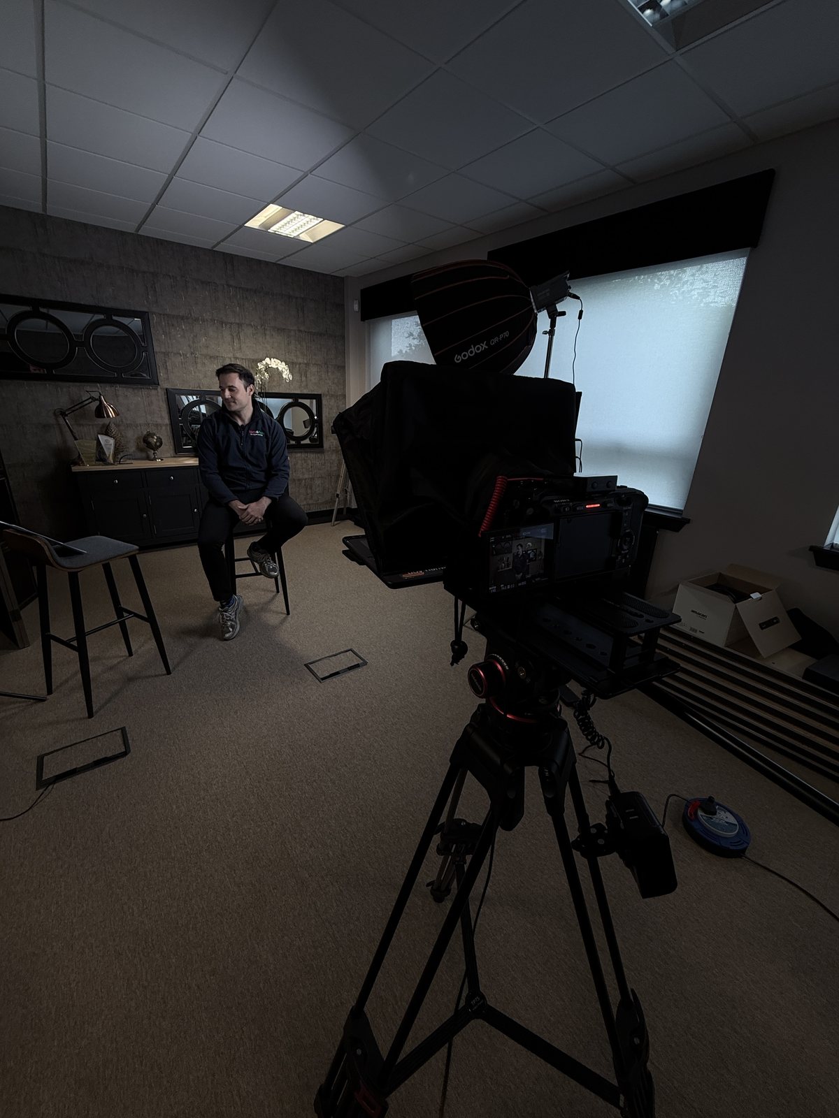 Video and film production set with camera and interview chair