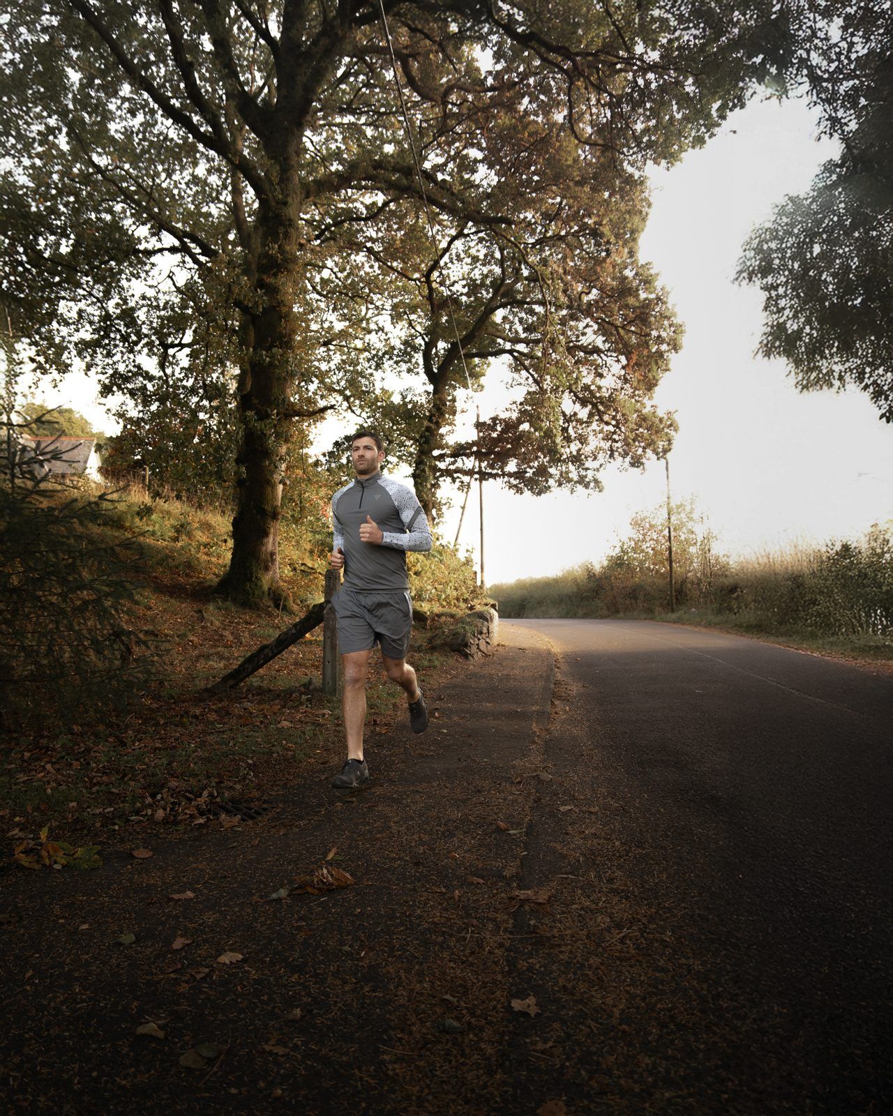 Brand campaign photography of a runner on a country road for Fallain Fitness